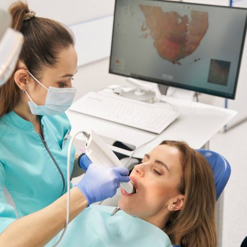 dentist-scanning-woman-teeth-with-dental-intraoral-2022-03-31-17-41-25-utc